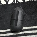 Black cylindrical object on a patterned surface